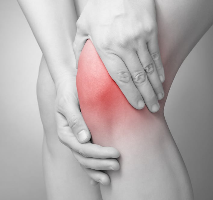 man suffering with knee pain