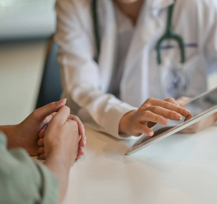 doctor showing a patient some information