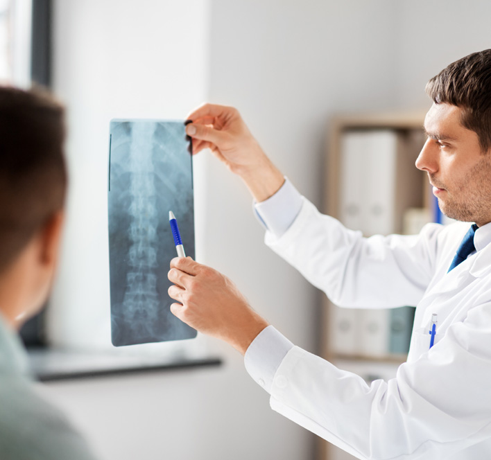 doctor showing x-ray to patient