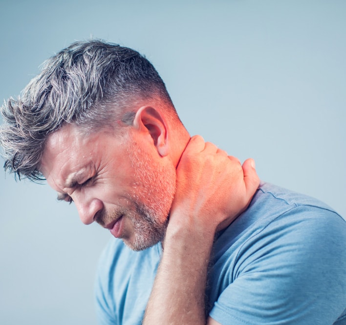man suffering from neck pain